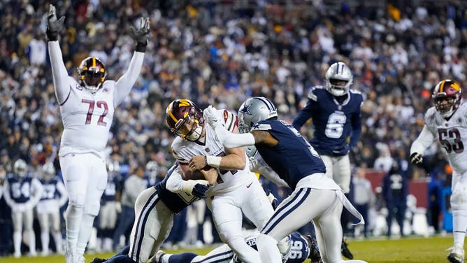 Washington Commanders QB Sam Howell runs for a TD vs. the Dallas Cowboys at FedExField in Landover, Maryland.
