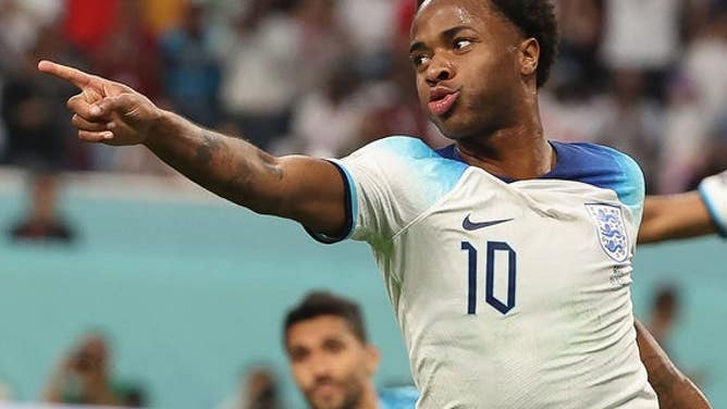 Raheem Sterling, of England, celebrates after scoring during a Group B match against Iran at the 2022 FIFA World Cup at Khalifa International Stadium in Doha, Qatar, Nov. 21, 2022.