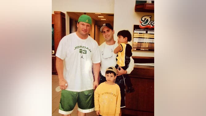 Israel Commandos Ezra and Jesse Zeit seen with father David and Dolphins linebacker Zach Thomas.