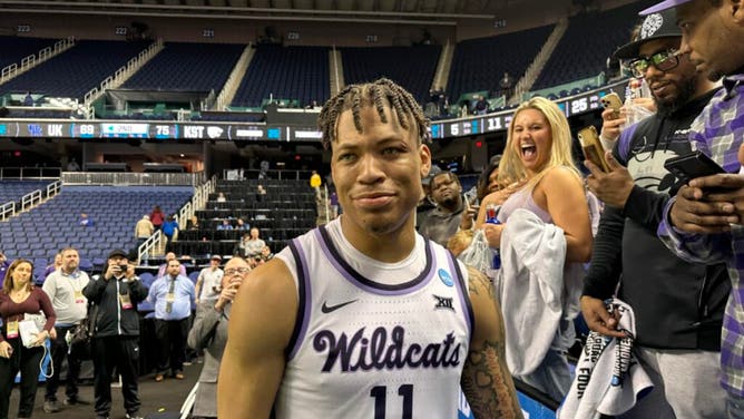 Kansas State player Keyontae Johnson reacts to a KSU fan