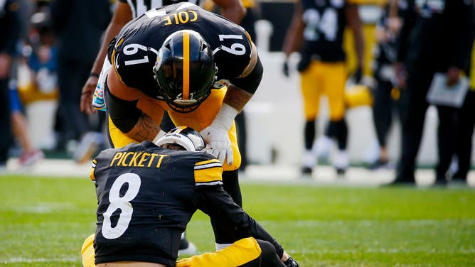 Steelers QB Kenny Pickett down on the field with what was later diagnosed as a concussion.