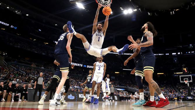 Duke big Dereck Lively reacts as he dunks during the 1st round of the NCAA Tournament at Amway Center in Orlando, Florida.