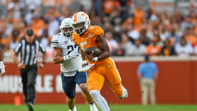 Hendon Hooker runs the ball during the game against Akron