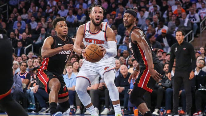 Knicks PG Jalen Brunson drives past Heat PG Kyle Lowry and Butler during Game 5 of the 2023 NBA playoffs at Madison Square Garden.
