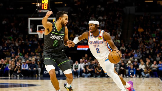 Oklahoma City Thunder PG Shai Gilgeous-Alexander drives to the basket against Minnesota Timberwolves F Kyle Anderson at Target Center in Minneapolis.