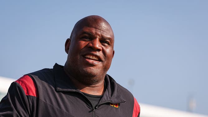 Assistant head coach and offensive coordinator Eric Bieniemy of the Washington Commanders reacts during training camp.