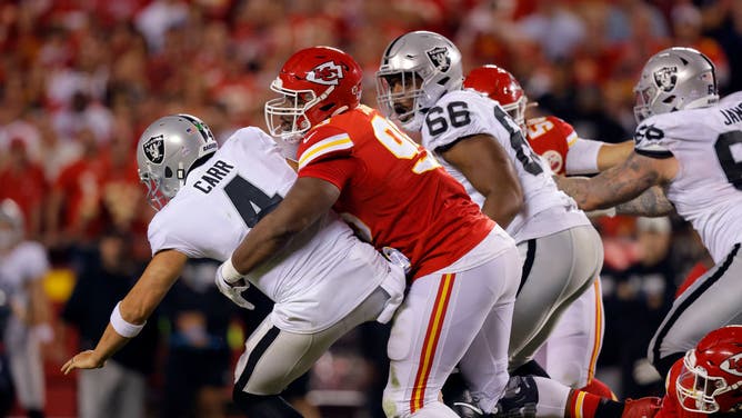 Las Vegas Raiders QB Derek Carr is sacked by Kansas City Chiefs DT Chris Jones at Arrowhead Stadium in Kansas City, Missouri.