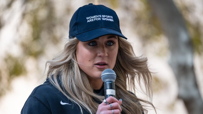 Riley Gaines speaks at supporters at Independent Women s Forum's \"Our Bodies, Our Sports: We Won't Back Down\" rally outside Phoenix City Hall on Jan. 11, 2024, in Phoenix.