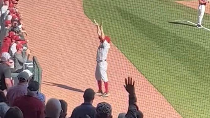 Alabama coach Brad Bohannon mocks Arkansas fans after being ejected. Courtesy of Jonathan Acosta
