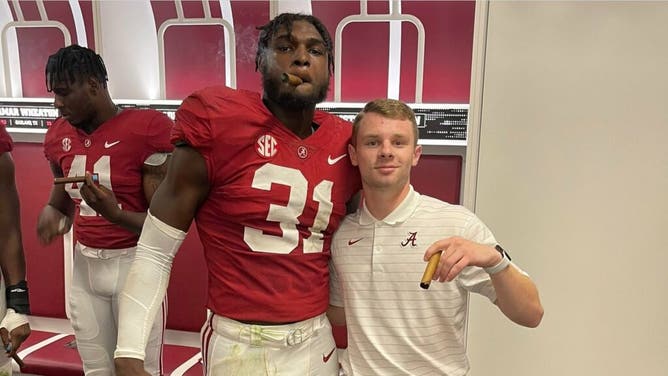 Alabama outside linebacker Will Anderson Jr. enjoys a victory cigar after the 52-24 win over Tennessee last season.