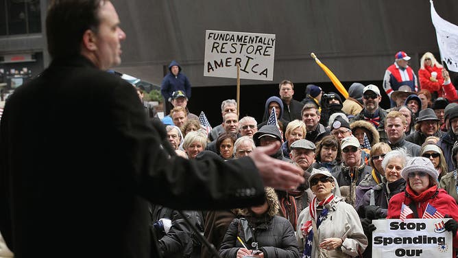 Radio talk show host Dan Proft speaks to supporters at a rally in Chicago, Illinois.