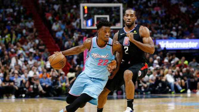 Miami Heat SF Jimmy Butler drives to the basket against Los Angeles Clippers SF Kawhi Leonard at American Airlines Arena in Miami.