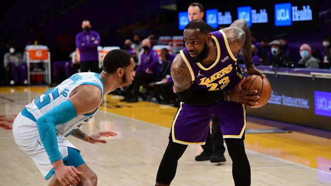 Los Angeles Lakers' LeBron James handles the ball against the Charlotte Hornets at STAPLES Center in Los Angeles.
