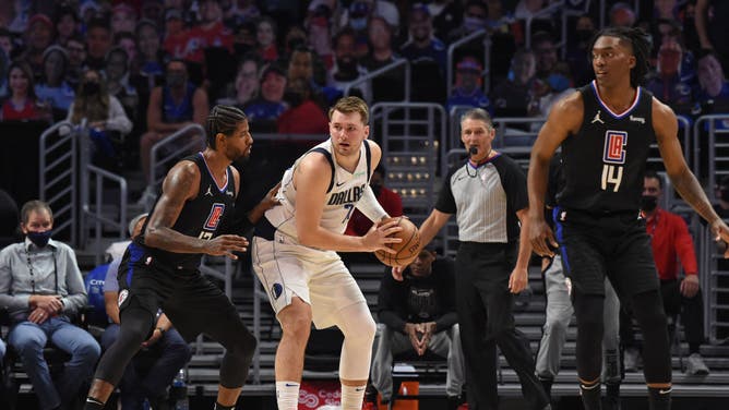 Dallas Mavericks' Luka Doncic posting up Los Angeles Clippers' wing Paul George during Round 1, Game 2 of the 2021 NBA Playoffs on May 25, 2021 at STAPLES Center in Los Angeles.