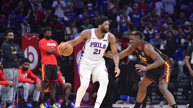 Philadelphia 76ers C Joel Embiid handles the ball against Atlanta Hawks C Clint Capela at Wells Fargo Center in Philadelphia.