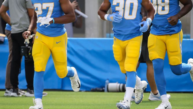 Los Angeles Chargers running backs Joshua Kelley (27) and Austin Ekeler (30).