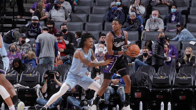 Sacramento Kings PG De'Aaron Fox posts up Memphis Grizzlies PG Ja Morant at Golden 1 Center in Sacramento, California.