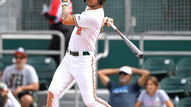 Miami Hurricanes slugger CJ Kayfus played hero on Sunday before narrowly blasting his teammate in celebration.