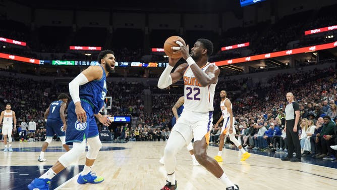 Phoenix Suns Deandre Ayton going up for a shot against Minnesota Timberwolves big Karl-Anthony Towns at Target Center in Minneapolis.