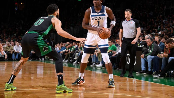 Boston Celtics SF Jayson Tatum defends Minnesota Timberwolves SF Anthony Edwards at the TD Garden in Boston.