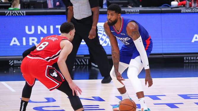 Clippers wing Paul George is defended by Bulls wing Zach LaVine at the United Center in Chicago.