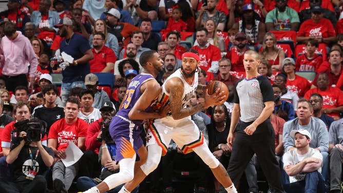 Phoenix Suns SF Mikal Bridges defends New Orleans Pelicans SF Brandon Ingram during Round 1 Game 6 of the 2022 NBA Playoffs at the Smoothie King Center in New Orleans.