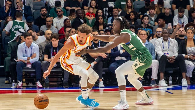 Milwaukee Bucks Jrue Holiday locking up Atlanta Hawks Trae Young at Etihad Arena in Abu Dhabi, United Arab Emirates.