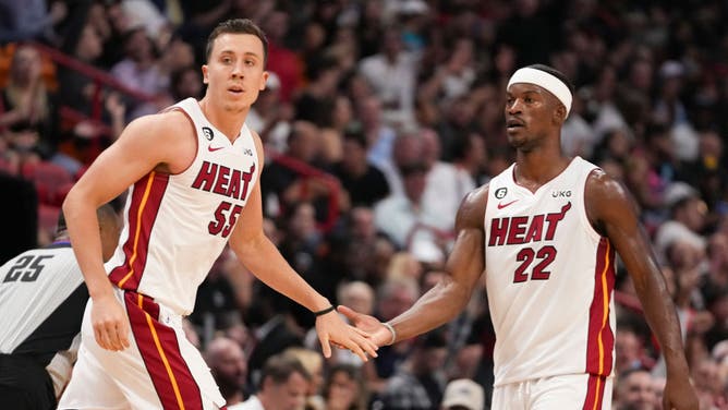 Miami Heat S Jimmy Butler daps up SG Duncan Robinson after he hit a 3-point shot vs. the Toronto Raptors at FTX Arena in Miami.