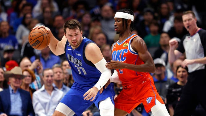 Mavericks All-Star Luka Doncic posts up Oklahoma City Thunder PG Shai Gilgeous-Alexander #2 at American Airlines Center in Dallas.