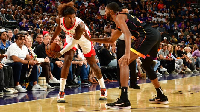 Houston Rockets SG Jalen Green sizes up Phoenix Suns SF Mikal Bridges at Footprint Center in Phoenix, Arizona.