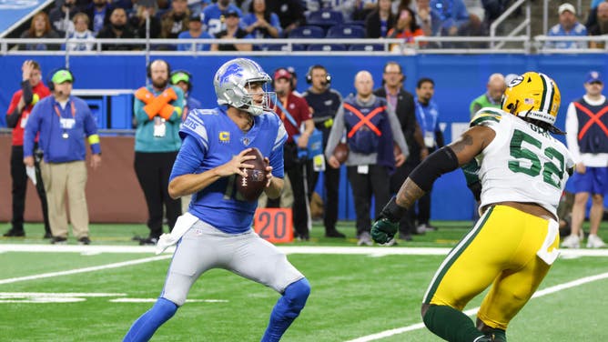 Detroit Lions QB Jared Goff looks for a receiver while being pressured by now-injured Green Bay Packers LB Rashan Gary at Ford Field in Detroit.