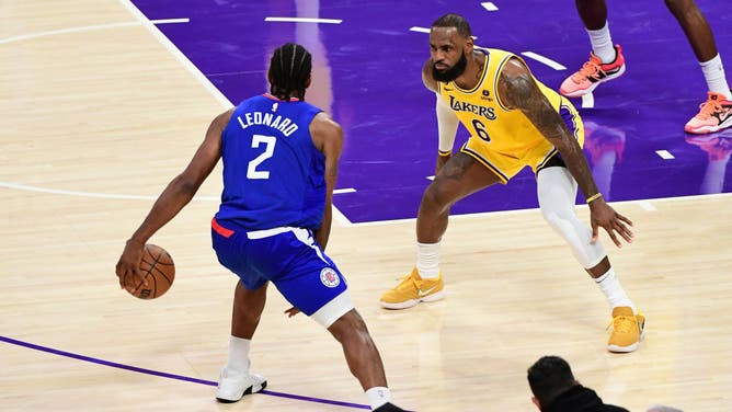 LeBron James plays defense on Kawhi Leonard at Crypto.Com Arena in Los Angeles, California.