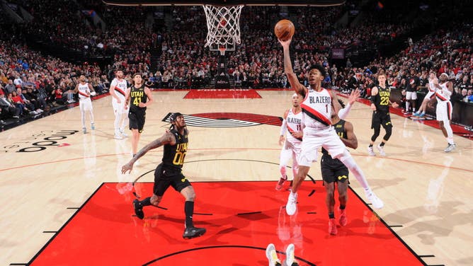 Trail Blazers' Anfernee Simons drives to the basket against the Jazz at the Moda Center Arena in Portland, Oregon.
