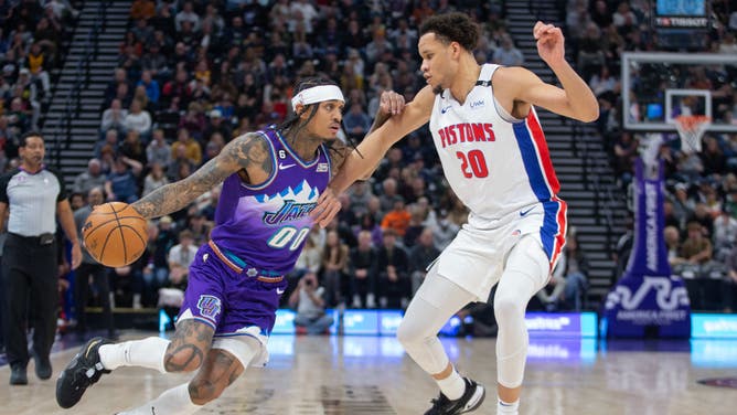 Utah Jazz SG Jordan Clarkson drives past Detroit Pistons SF Kevin Knox at the Vivint Arena in Salt Lake City, Utah.