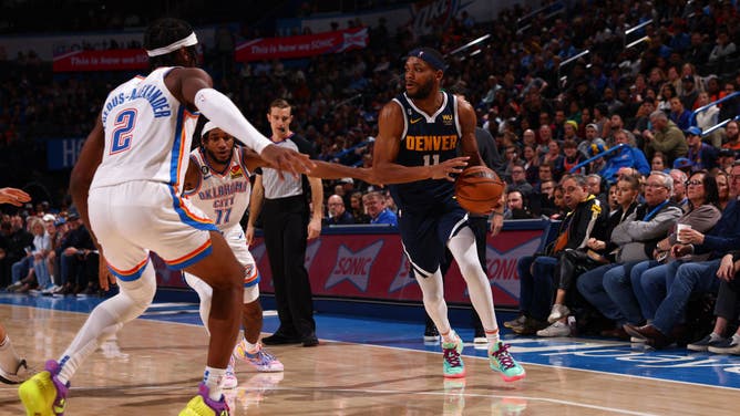 Denver Nuggets wing Bruce Brown dribbles the ball during the game against the Oklahoma City Thunder at Paycom Arena in Oklahoma City, Oklahoma.