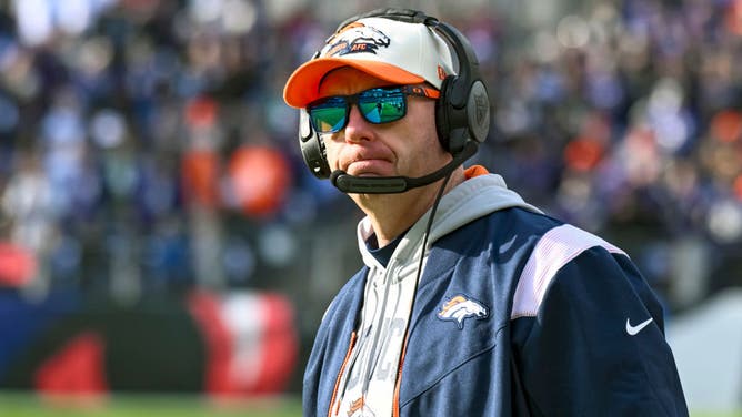 Denver Broncos offensive coordinator, Justin Outten in action during the Denver Broncos game versus the Baltimore Ravens.