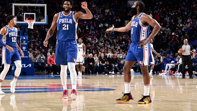 Philadelphia 76ers big Joel Embiid high-fives James Harden during the game against the Sacramento Kings at the Wells Fargo Center in Philadelphia.