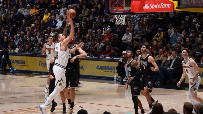 Nikola Jokic shoots the ball vs. the Grizzlies at the Ball Arena in Denver, Colorado.