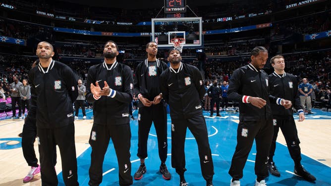 The Los Angeles Clippers await the opening tip vs. the Washington Wizards at Capital One Arena in Washington, DC.