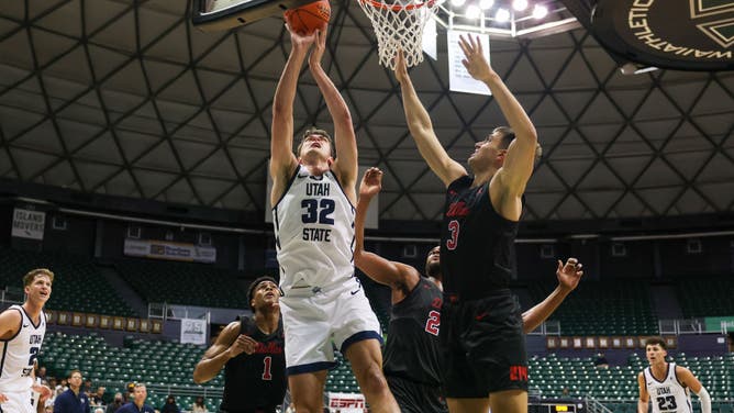 Utah State Aggies C Trevin Dorius goes for a putback against the SMU Mustangs at SimpliFi Arena in Honolulu, Hawaii.