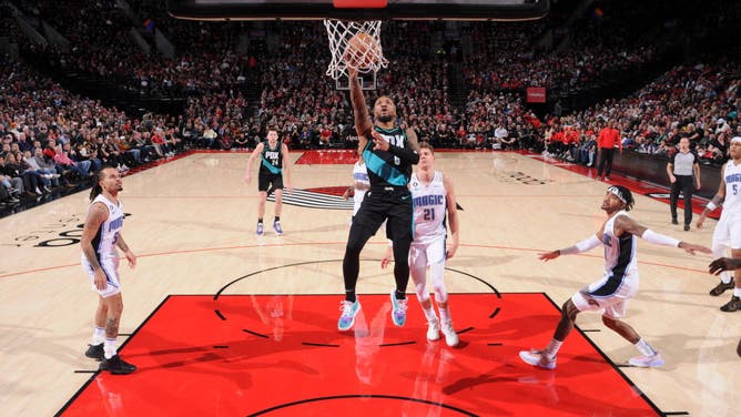 Damian Lillard drives to the basket on the Orlando Magic at the Moda Center Arena in Portland, Oregon.