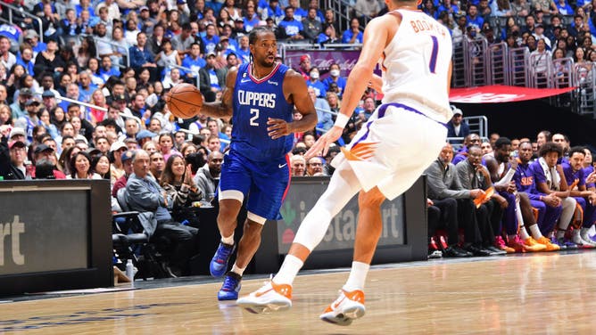 Kawhi Leonard handles the ball during the game vs. the Suns at Crypto.Com Arena in Los Angeles.