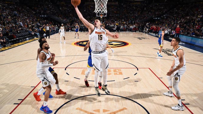 Nuggets big Nikola Jokic takes a layup vs. the Warriors at the Ball Arena in Denver, Colorado.