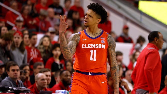 Clemson Tigers SG Brevin Galloway reacts following a 3-point basket vs. the NC State Wolfpack at PNC Arena in Raleigh, North Carolina.
