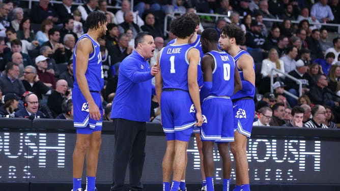 Xavier Musketeers coach Sean Miller speaks with his players during a timeout in a game against Providence at Amica Mutual Pavilion in Providence, Rhode Island.