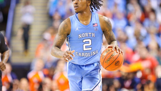 Former North Carolina guard Caleb Love commits to Arizona after initially committing to Michigan.