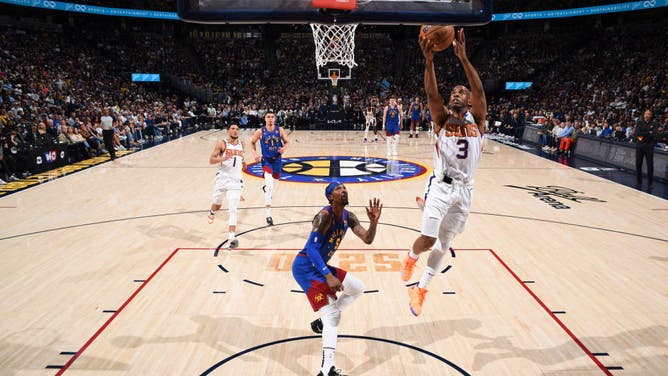 Suns PG Chris Paul drives to the basket during Game 1 of the Western Conference Semifinals vs. the Nuggets at the Ball Arena.