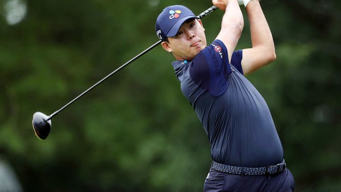 Si Woo Kim plays his shot from the 7th tee during the 1st round of the 2020 Travelers Championship at TPC River Highlands.