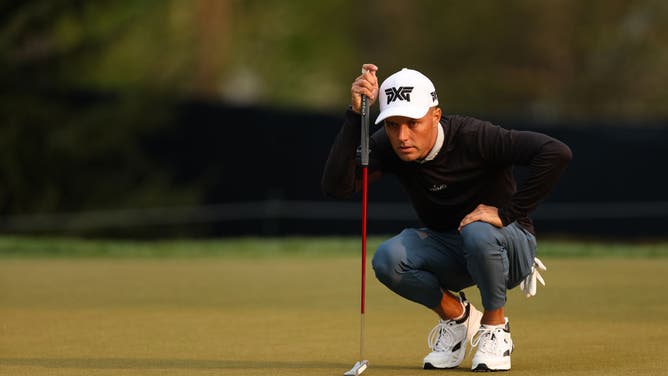 Eric Cole reads his putt on the 7th hole during the 1st round of the PGA Championship at Oak Hill Country Club in Rochester, New York.
