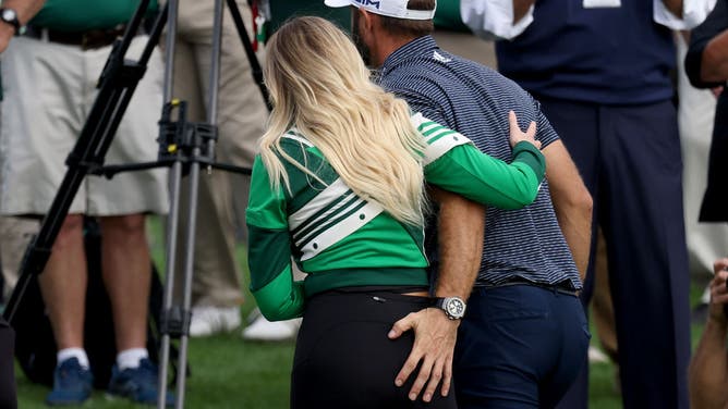 Johnson walks off the green with then-fiancée Paulina Gretzky after winning the 2020 Masters at Augusta National Golf Club in Georgia.